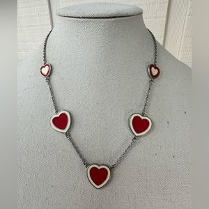 Red hearts on a silvertone chain necklace